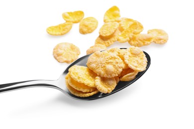 Photo of Metal spoon of tasty crispy corn flakes on white background