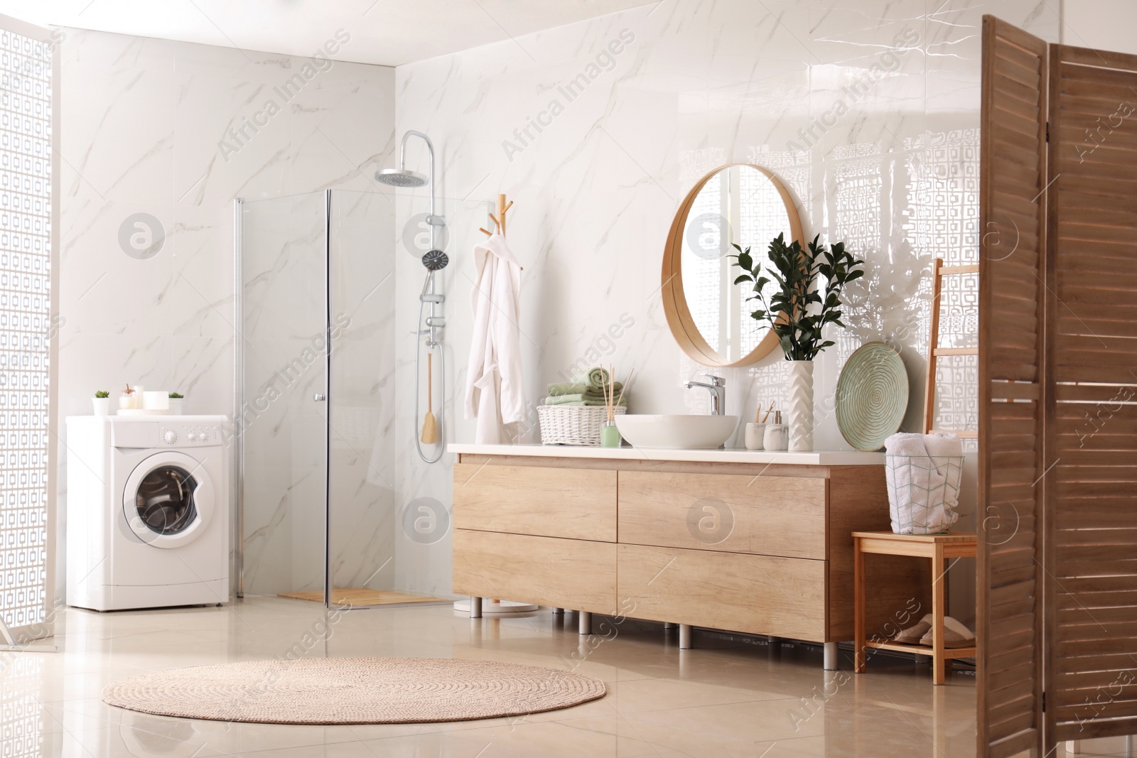 Photo of Modern bathroom interior with stylish mirror and vessel sink