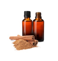 Image of Bottles of natural essential oil, dry cinnamon sticks and powder on white background