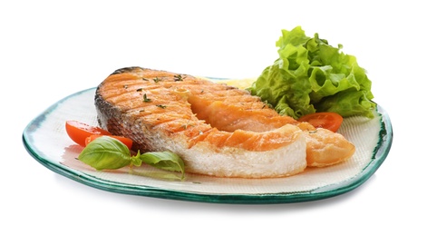 Photo of Plate with tasty salmon steak on white background