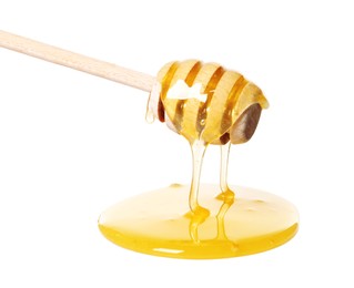 Photo of Natural honey dripping from dipper on white background