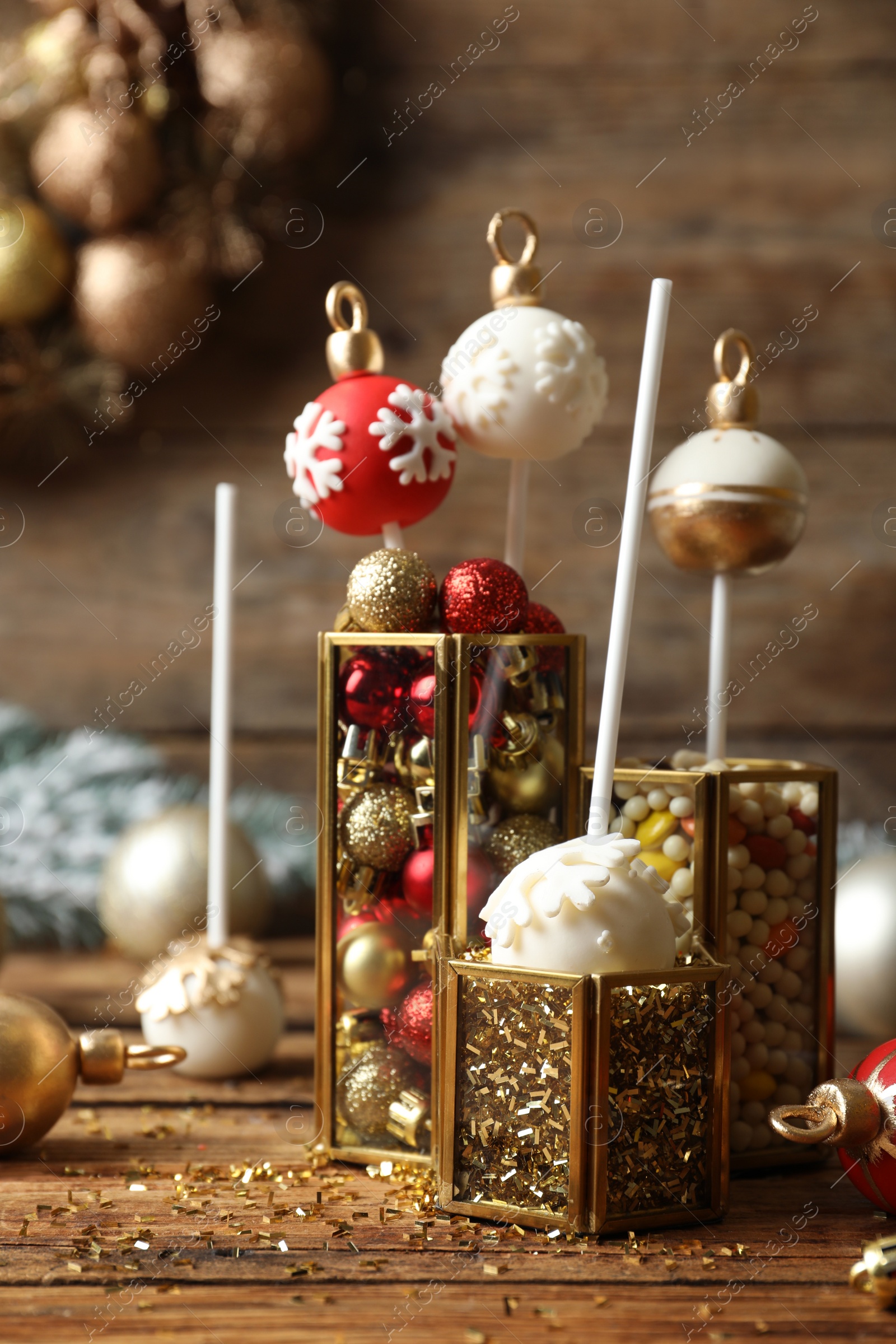 Photo of Composition with delicious Christmas ball cake pops on wooden table