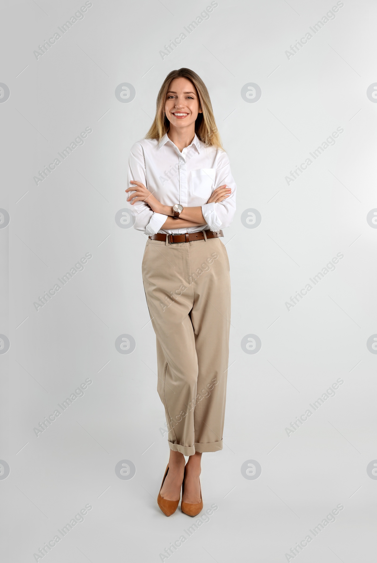 Photo of Full length portrait of beautiful young businesswoman on white background