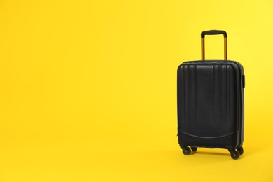 Photo of Stylish suitcase on color background. Space for text