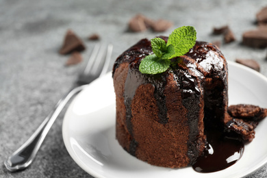 Delicious warm chocolate lava cake on plate, closeup