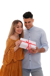 Photo of Lovely couple with gift box on white background. Valentine's day celebration