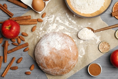 Photo of Flat lay composition with raw rye dough and ingredients on wooden background