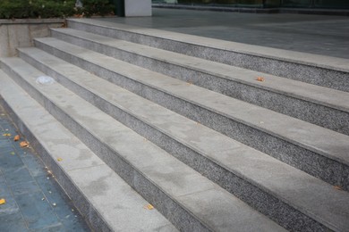 View of empty grey tile staircase outdoors