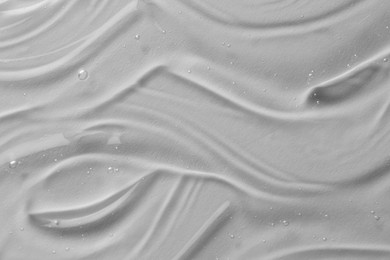 Photo of Texture of transparent shower gel on white background, closeup