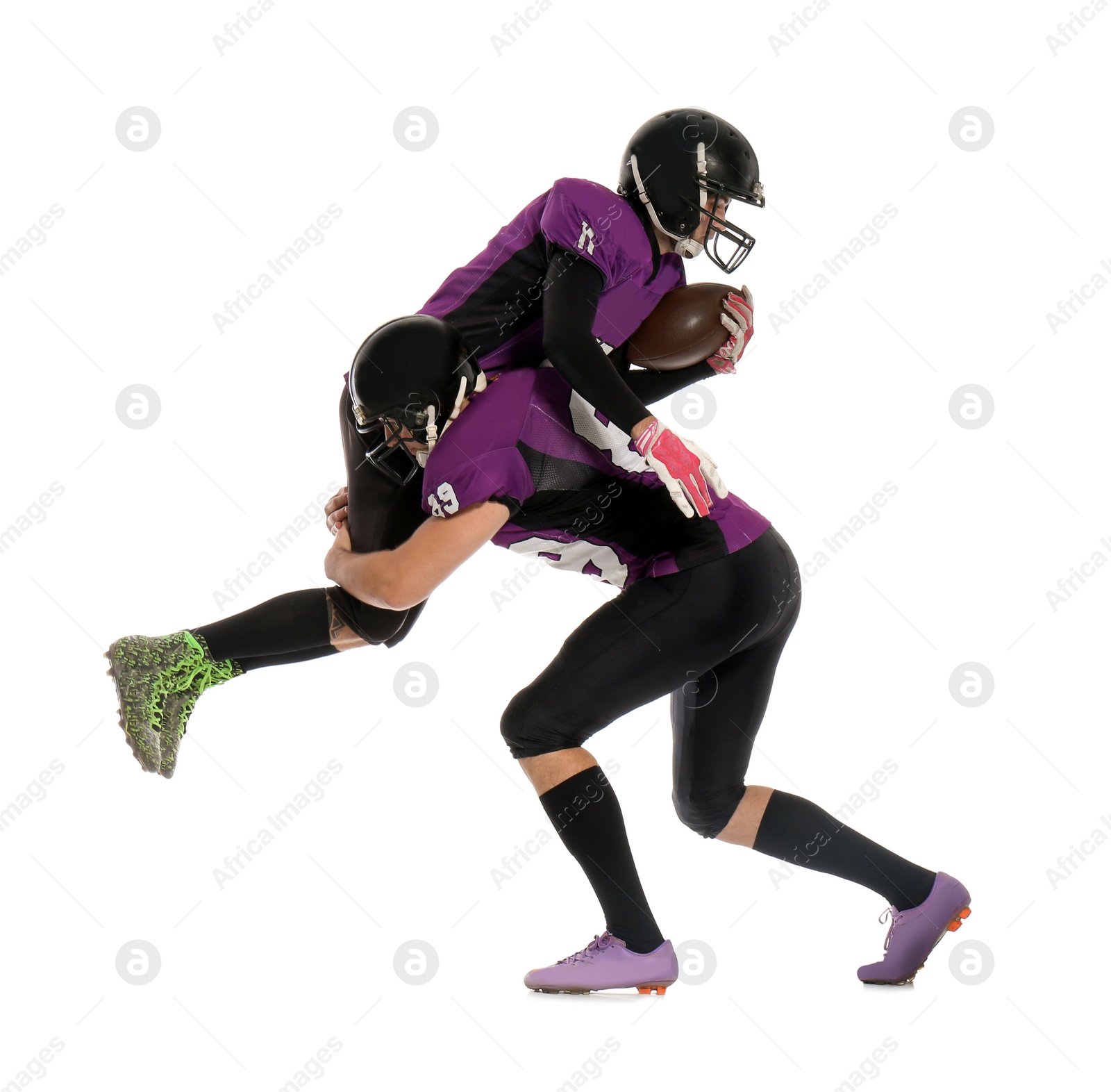 Photo of Men in uniform playing American football on white background