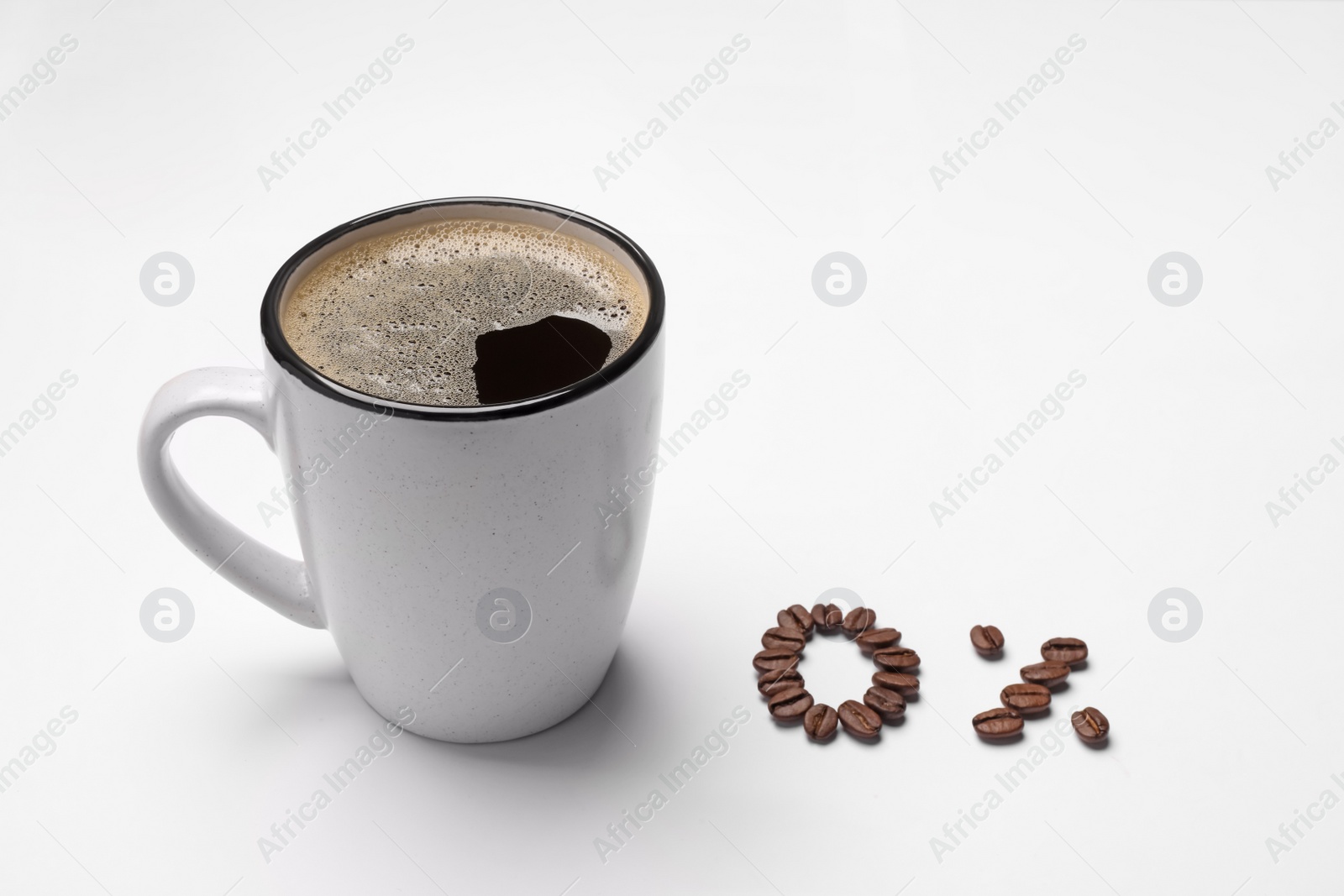 Photo of Cup of coffee and 0 percent made with beans on white background. Decaffeinated drink