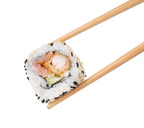 Photo of Holding sushi roll with chopsticks on white background, closeup