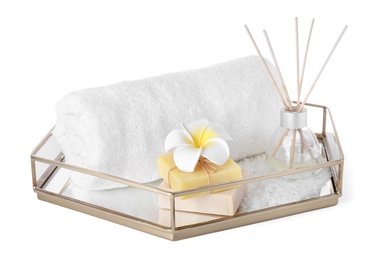Tray with towel and spa supplies isolated on white
