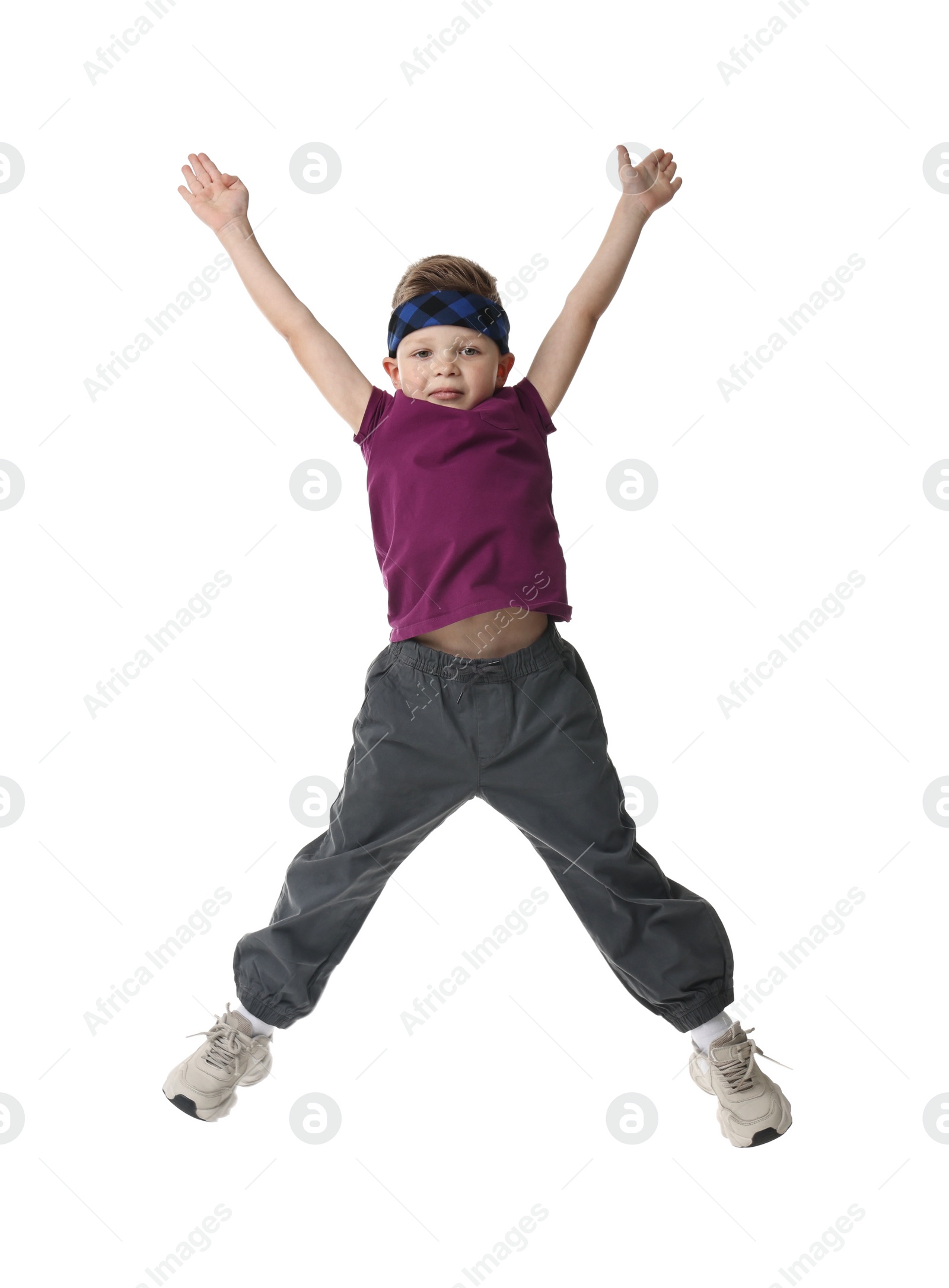 Photo of Happy little boy dancing on white background