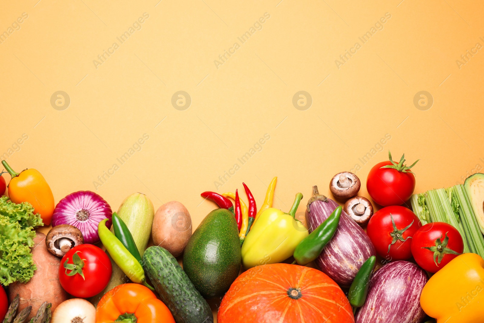 Photo of Flat lay composition with fresh vegetables on yellow background. Space for text