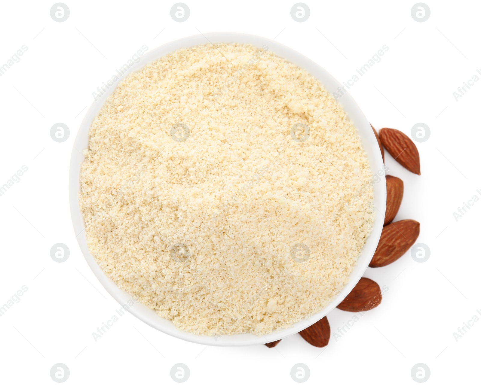 Photo of Bowl with almond flour and nuts on white background, top view