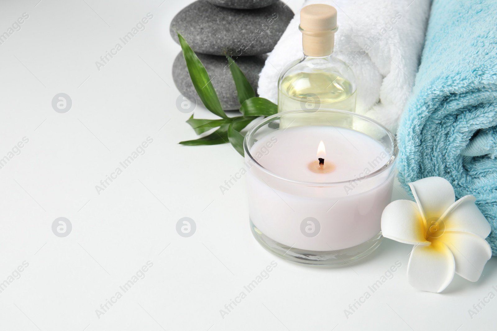 Photo of Beautiful spa composition with candle on white background