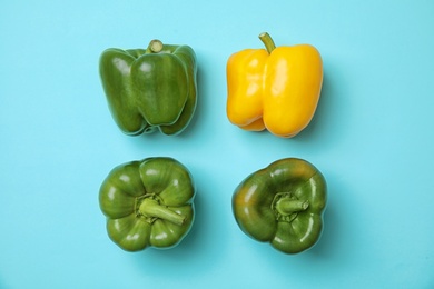 Flat lay composition with raw ripe paprika peppers on color background