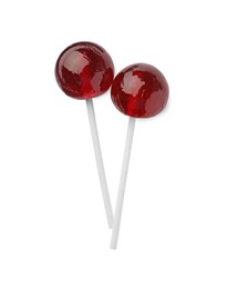 Photo of Two sweet red lollipops isolated on white, top view