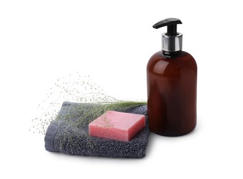 Soap bar, dispenser and terry towel on white background