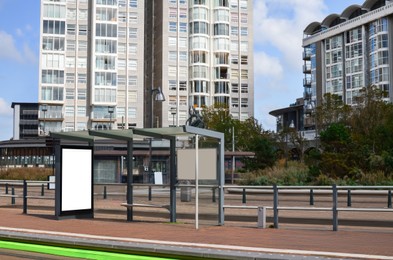 Public transport stop with bench on city street