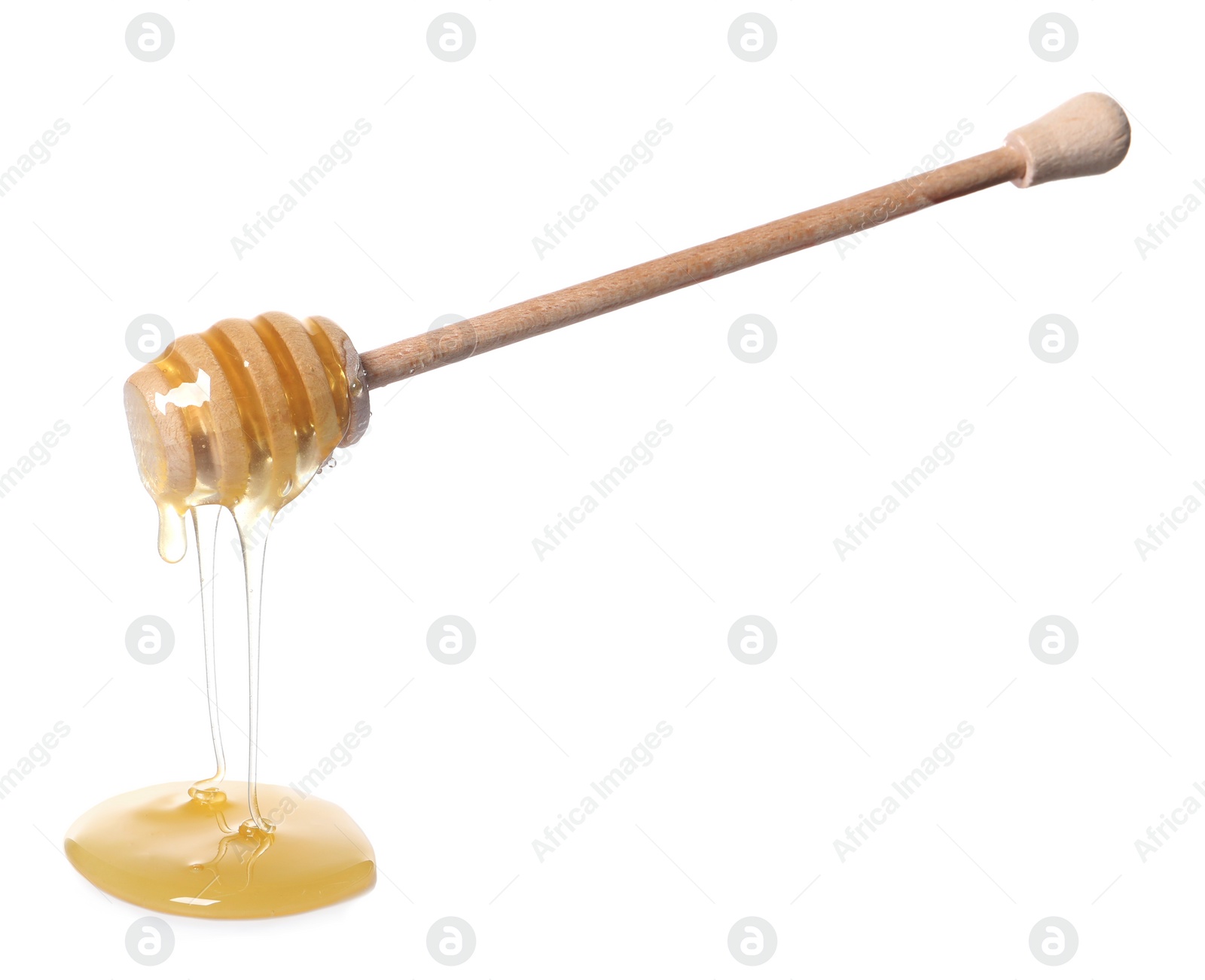 Photo of Natural honey dripping from dipper on white background