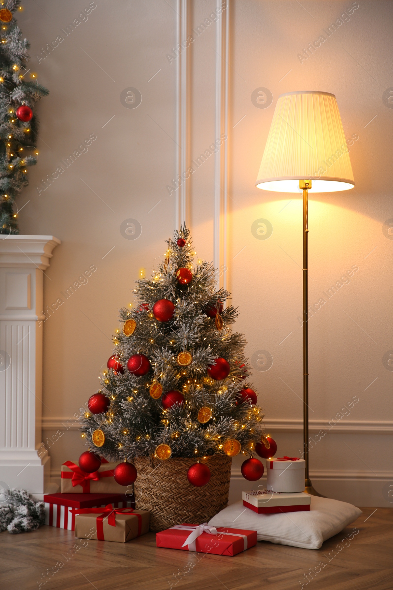 Photo of Beautiful Christmas tree and gift boxes in room