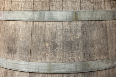 Photo of Traditional wooden barrel as background, closeup. Wine making