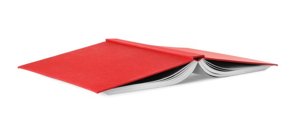 Photo of Open book with red cover on white background