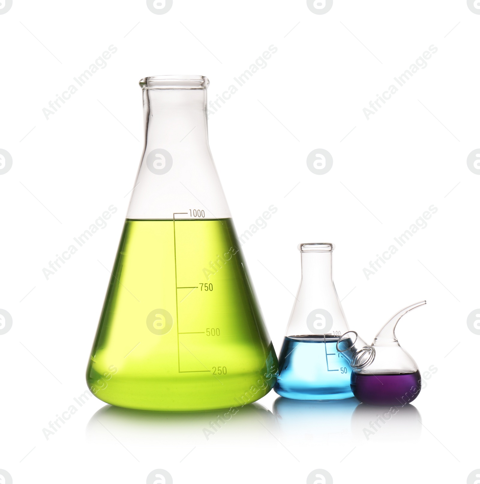 Photo of Set of lab glassware with color liquids isolated on white. Solution chemistry