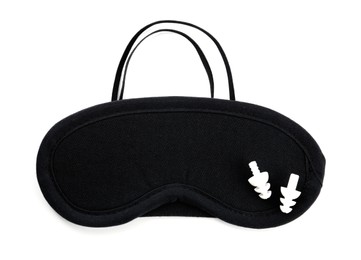 Photo of Pair of ear plugs and black sleeping mask on white background, top view