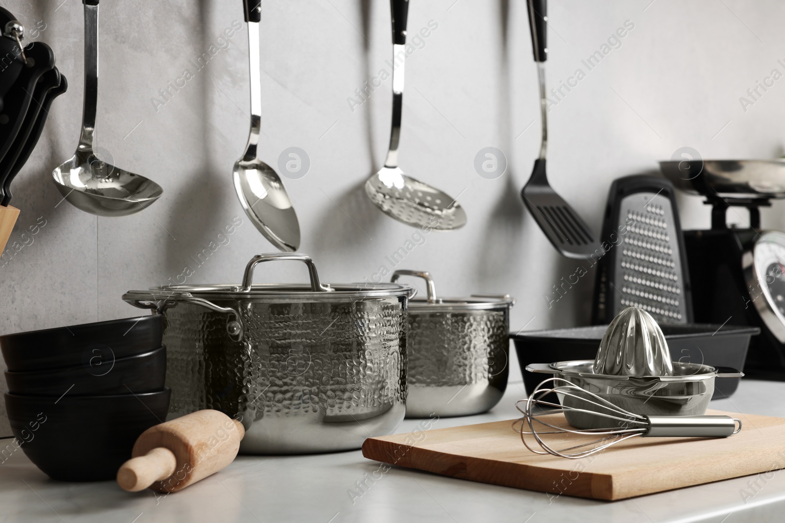 Photo of Set of different utensils on countertop in kitchen