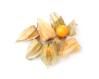 Many ripe physalis fruits with calyxes isolated on white, top view