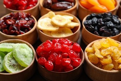 Bowls with different dried fruits on table. Healthy lifestyle