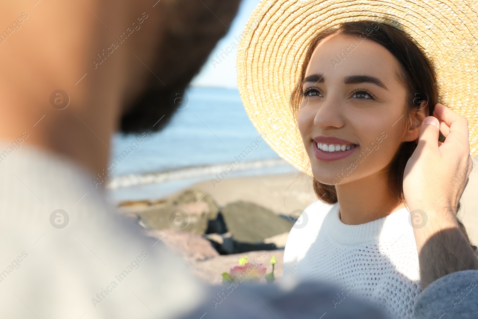 Photo of Happy young couple at beach. Honeymoon trip