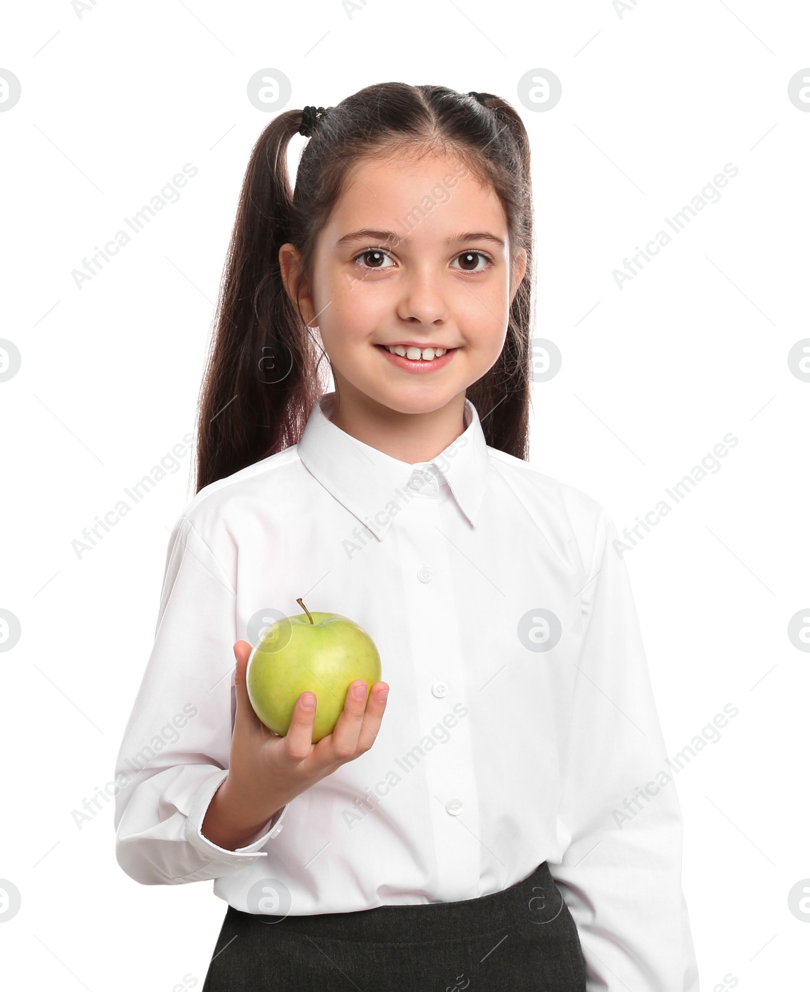 Photo of Little girl holding apple on white background. Healthy food for school lunch