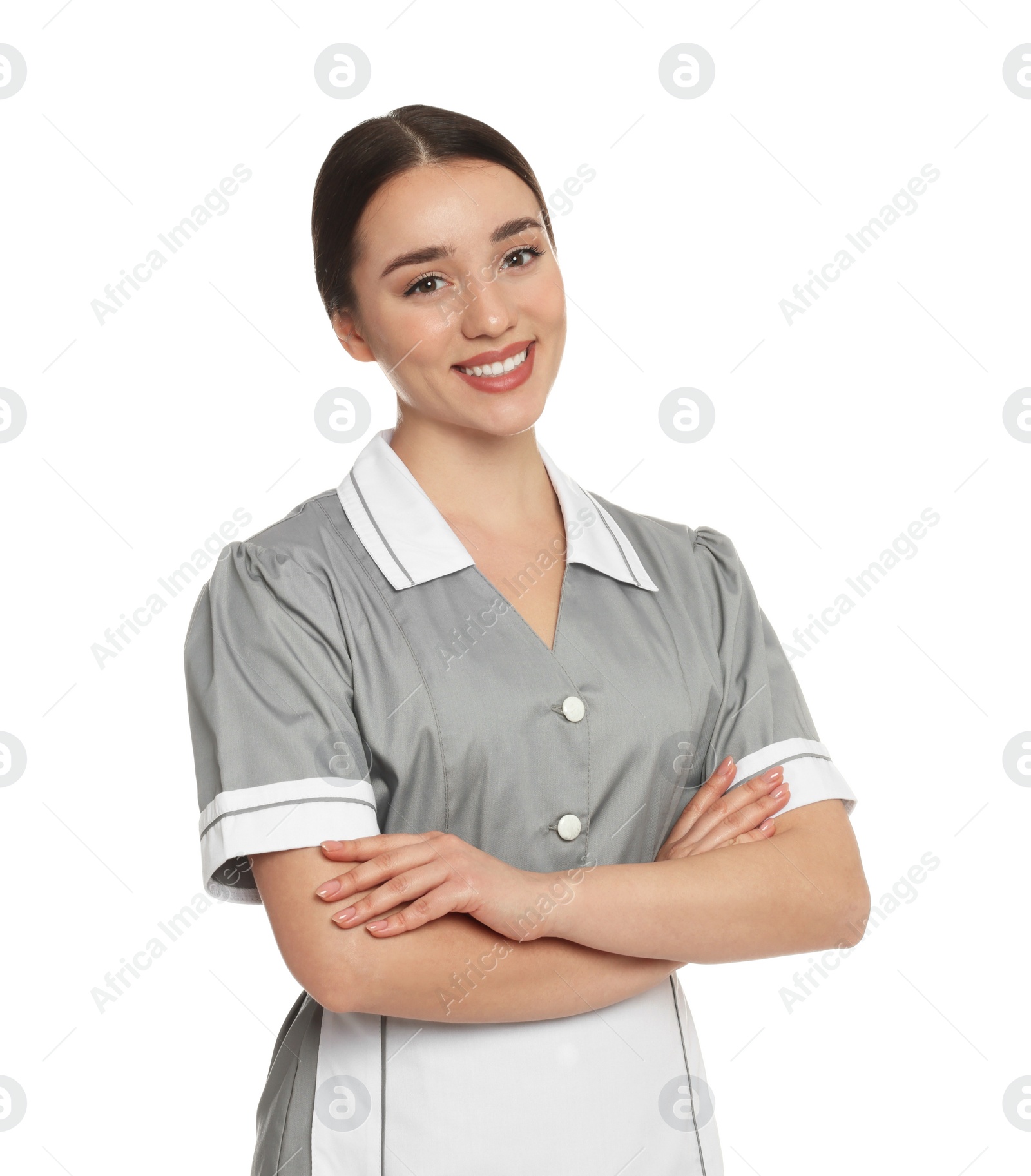 Photo of Portrait of young chambermaid in tidy uniform on white background