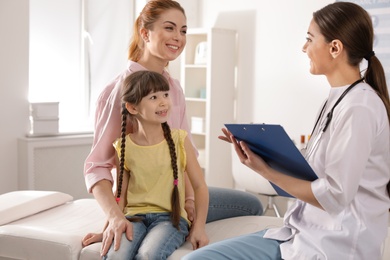 Mother with child visiting doctor in hospital