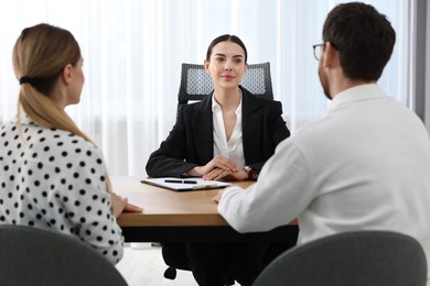 Couple having meeting with lawyer in office