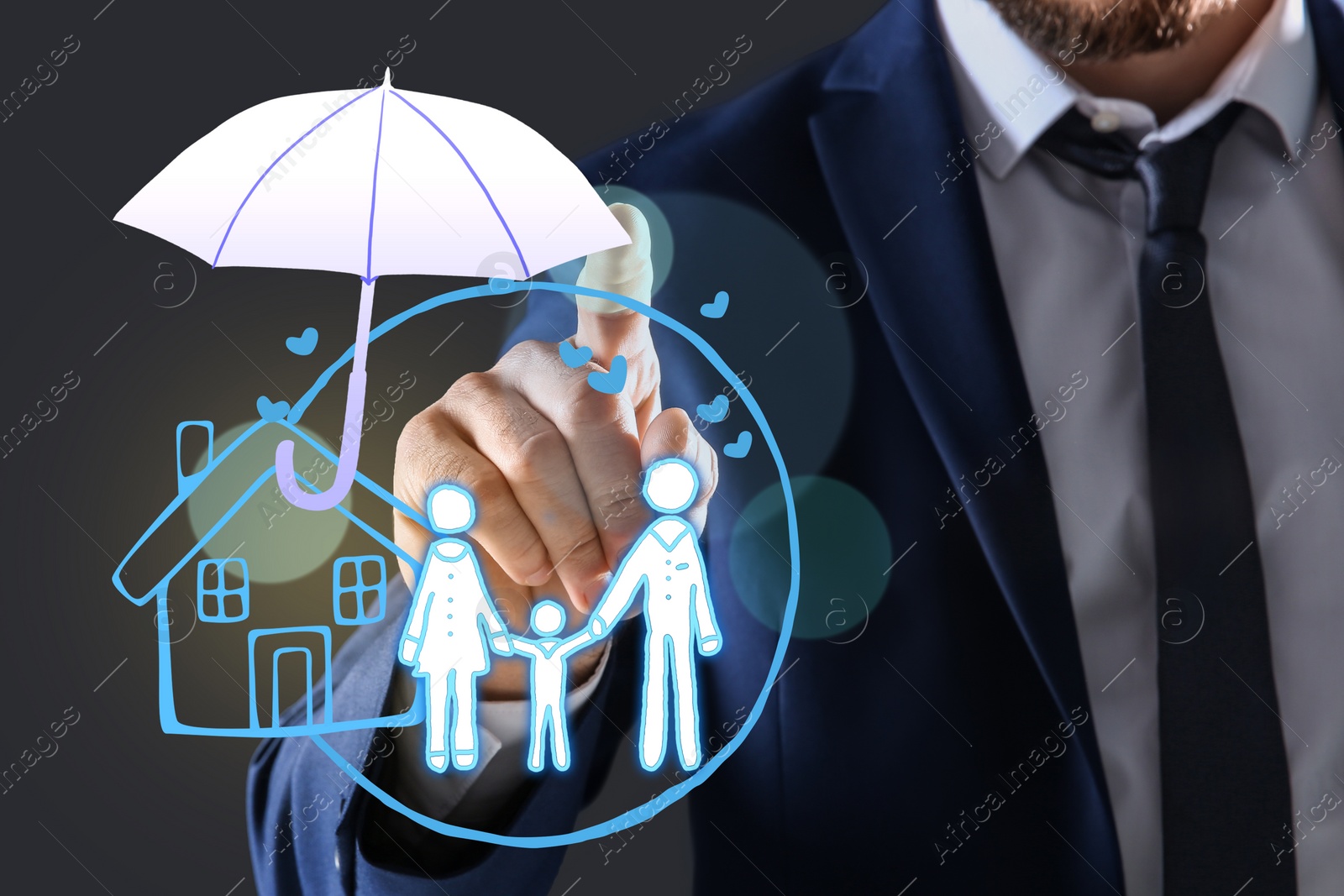 Image of Insurance concept - umbrella demonstrating protection. Man using virtual screen with illustrations, closeup