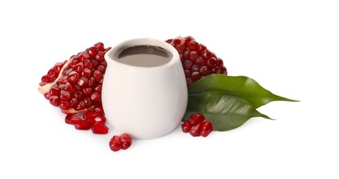 Photo of Tasty pomegranate sauce and fresh ripe fruit on white background