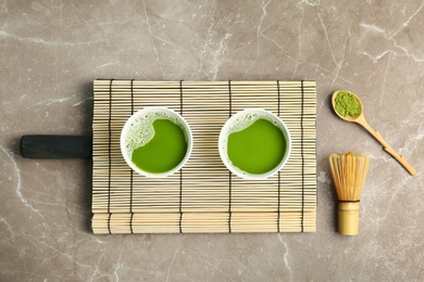 Flat lay composition with matcha tea on table