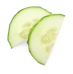 Photo of Slices of fresh cucumber isolated on white, top view