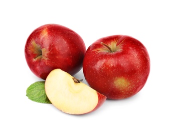 Ripe juicy red apples with leaf on white background