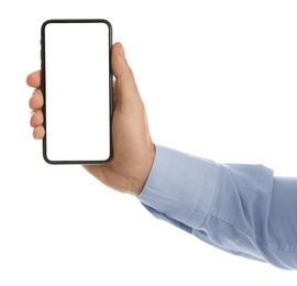 Man holding mobile phone with empty screen on white background, closeup