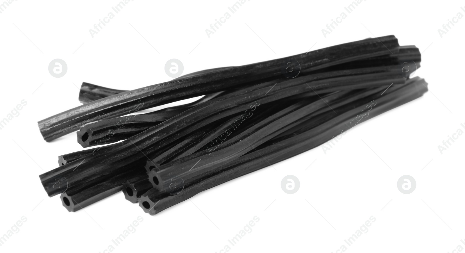 Photo of Tasty black liquorice candies on white background