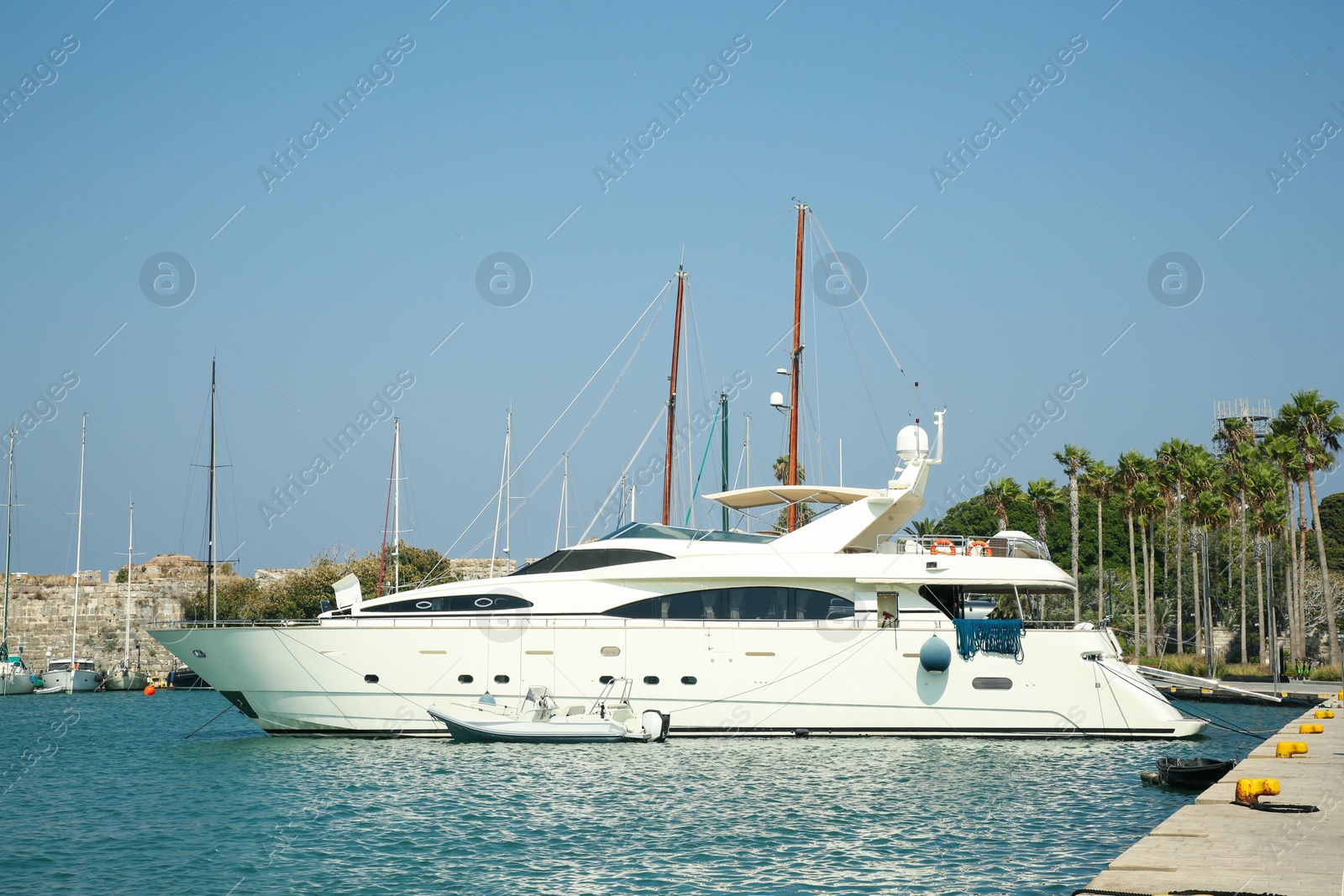 Photo of Beautiful view of sea port with moored yacht on sunny day