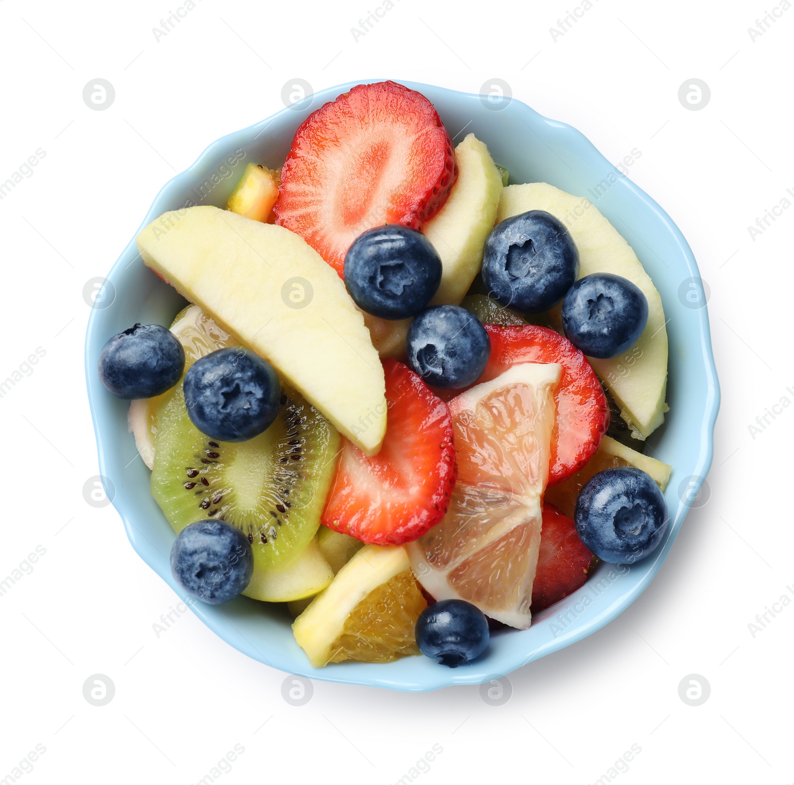 Photo of Tasty fruit salad in bowl isolated on white, top view