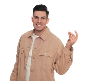Photo of Handsome man snapping fingers on white background