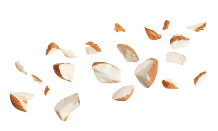 Pieces of tasty almonds on white background